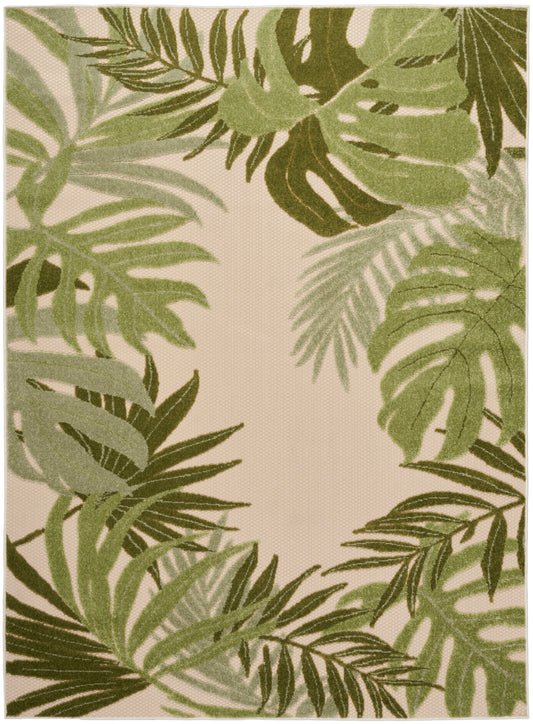 Rectangular outdoor rug with layered green palm fronds on beige background; woven textile.