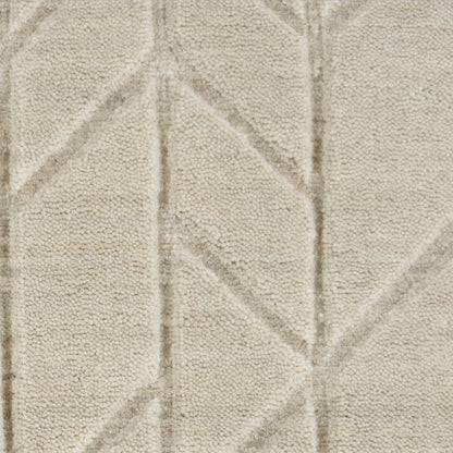 Cream textured rug with a subtle geometric chevron/diamond pattern and plush pile.