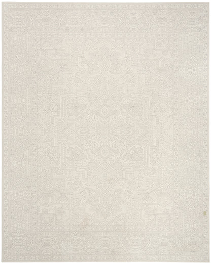 Cream rectangular rug with a faint geometric pattern and soft textured weave; versatile for living spaces.