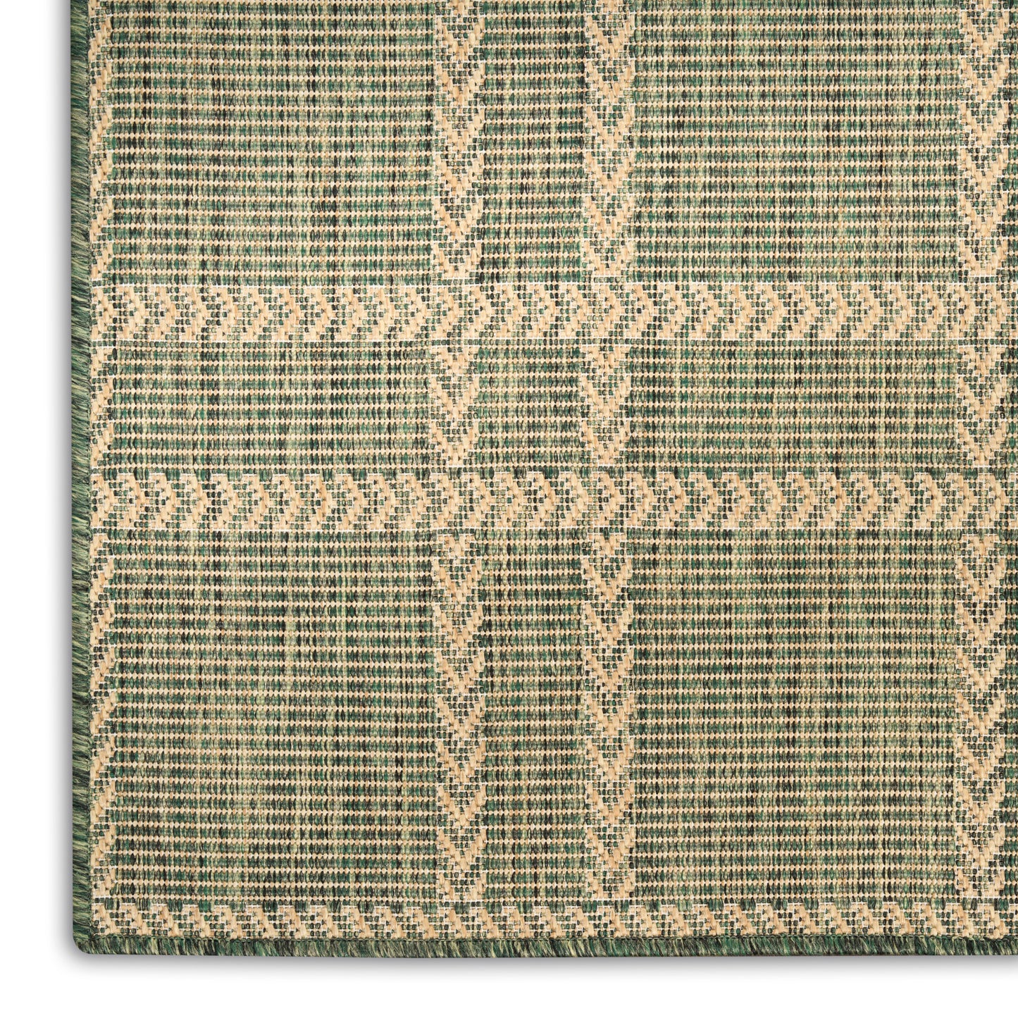 Green and beige woven rug with geometric lattice pattern of chevrons and stripes; low-pile rug.