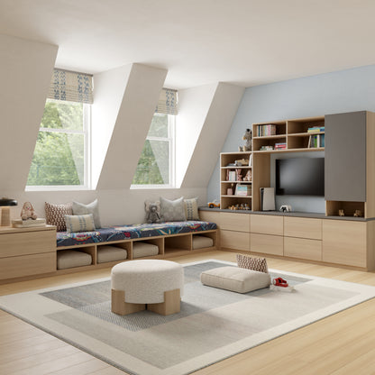 Bright Scandinavian-style living room with light wood storage wall, window-seat bench, soft cushions, and TV cabinet.