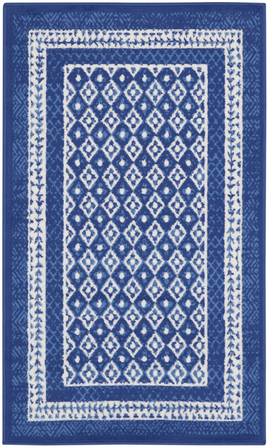 Blue and white rectangular area rug with diamond lattice center and white border stripes, modern geometric style.