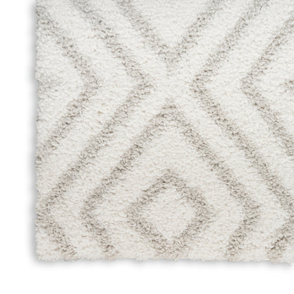 Cream shag rug with plush pile and light gray diamond lattice pattern.