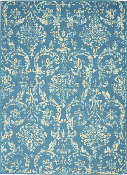 Blue rug with cream damask pattern; ornate floral medallions and scrolling motifs in a vintage-inspired design.