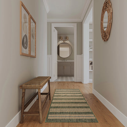 Rustic hallway with wooden bench, green striped runner rug, beige walls, wicker round mirror, framed art.
