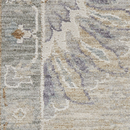 Close-up of a plush beige oriental rug with lavender floral motifs and a gray border.