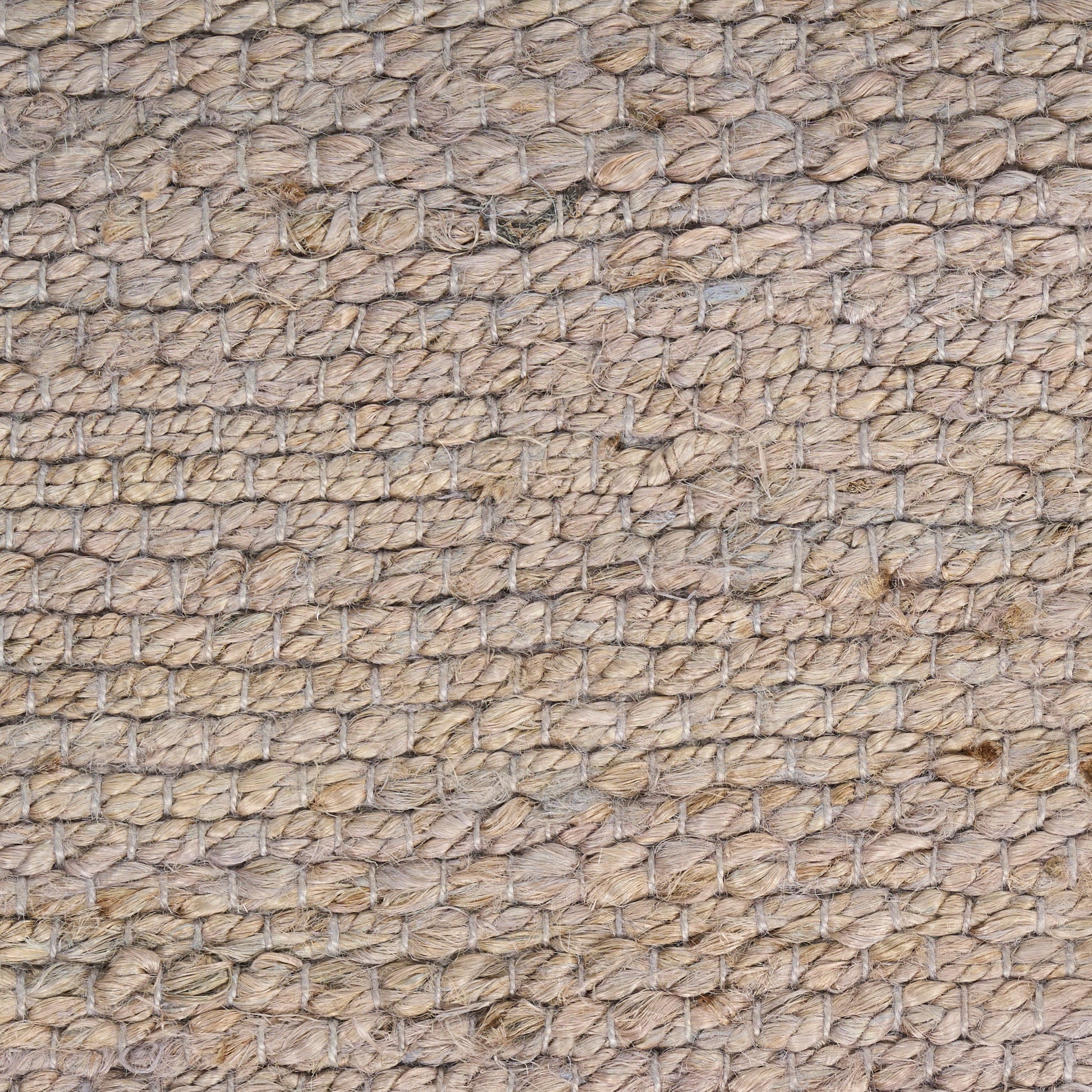 Natural jute rug close-up, beige woven texture with knotted loop pattern; rustic coastal floor mat.