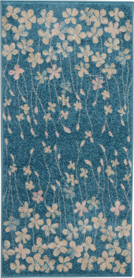 Teal blue floral runner rug with cream and pale pink blossoms on slender stems.