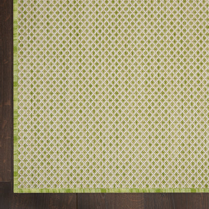 Cream background rug with olive-green small repeating motif and brown border on dark wood; 4' x 4' square.
