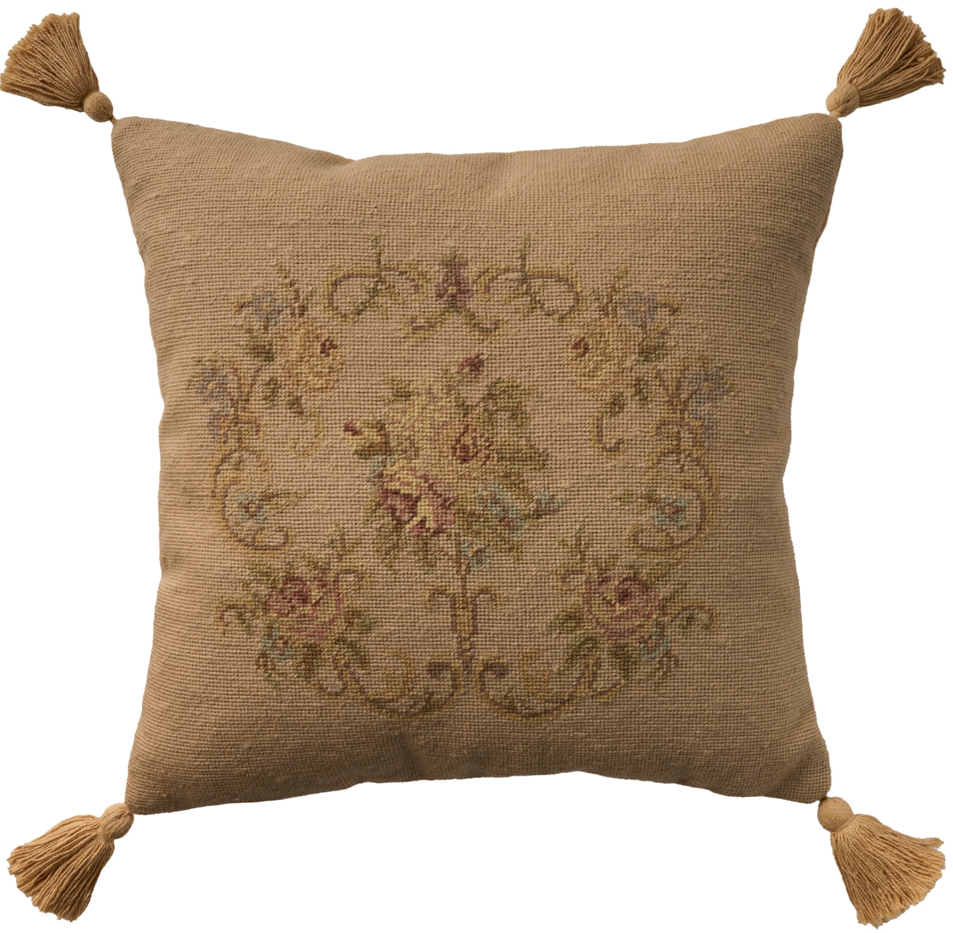 Beige burlap-look square pillow with four corner tassels and a faded vintage floral tapestry design.