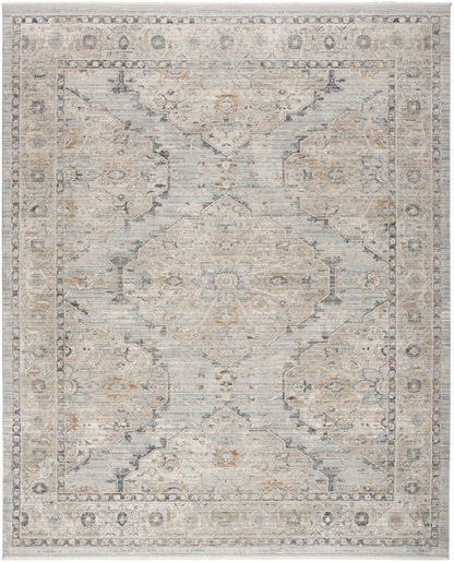 Rectangular area rug in blue-gray and ivory with a distressed oriental medallion design and floral border.