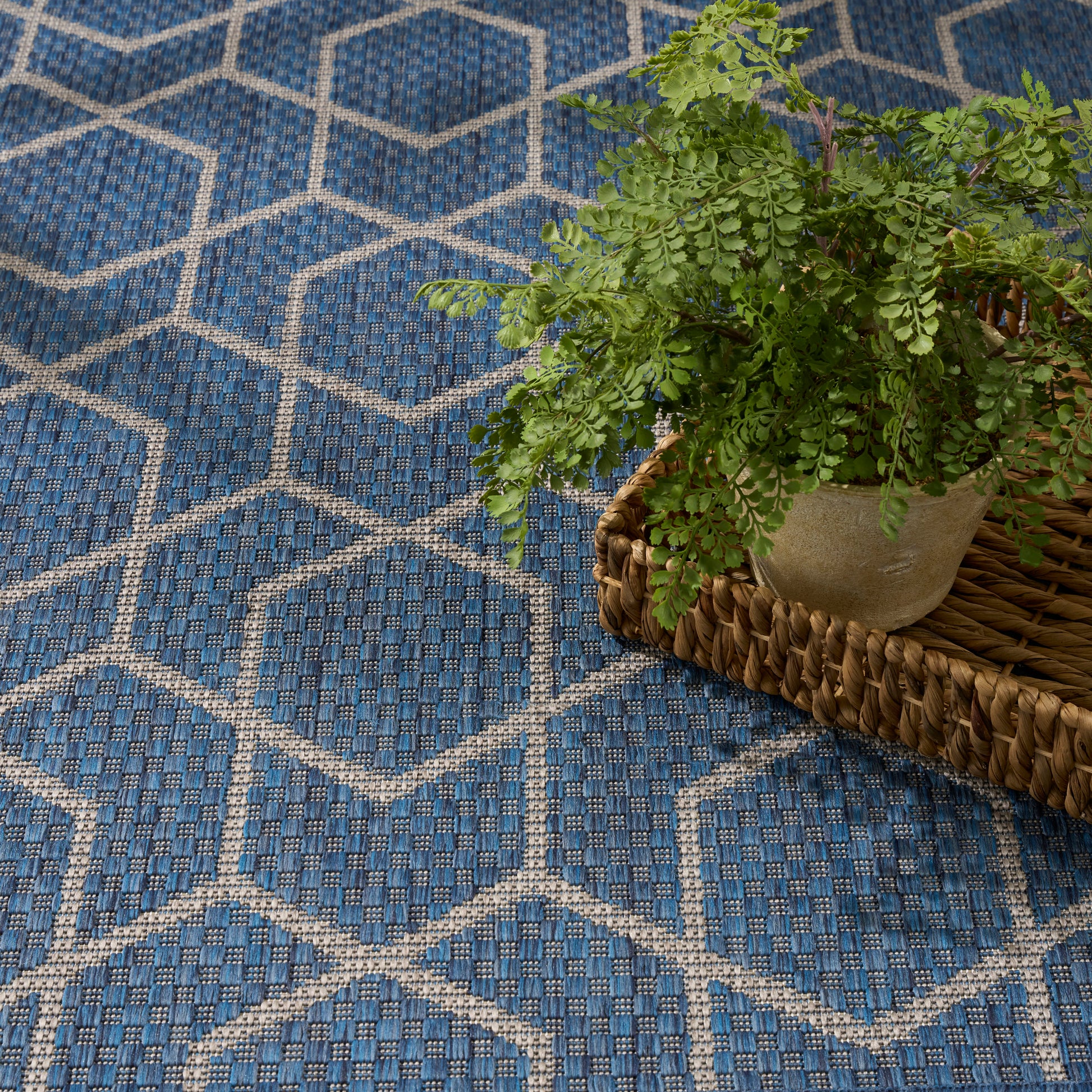 Blue & white geometric rug with hexagon lattice.