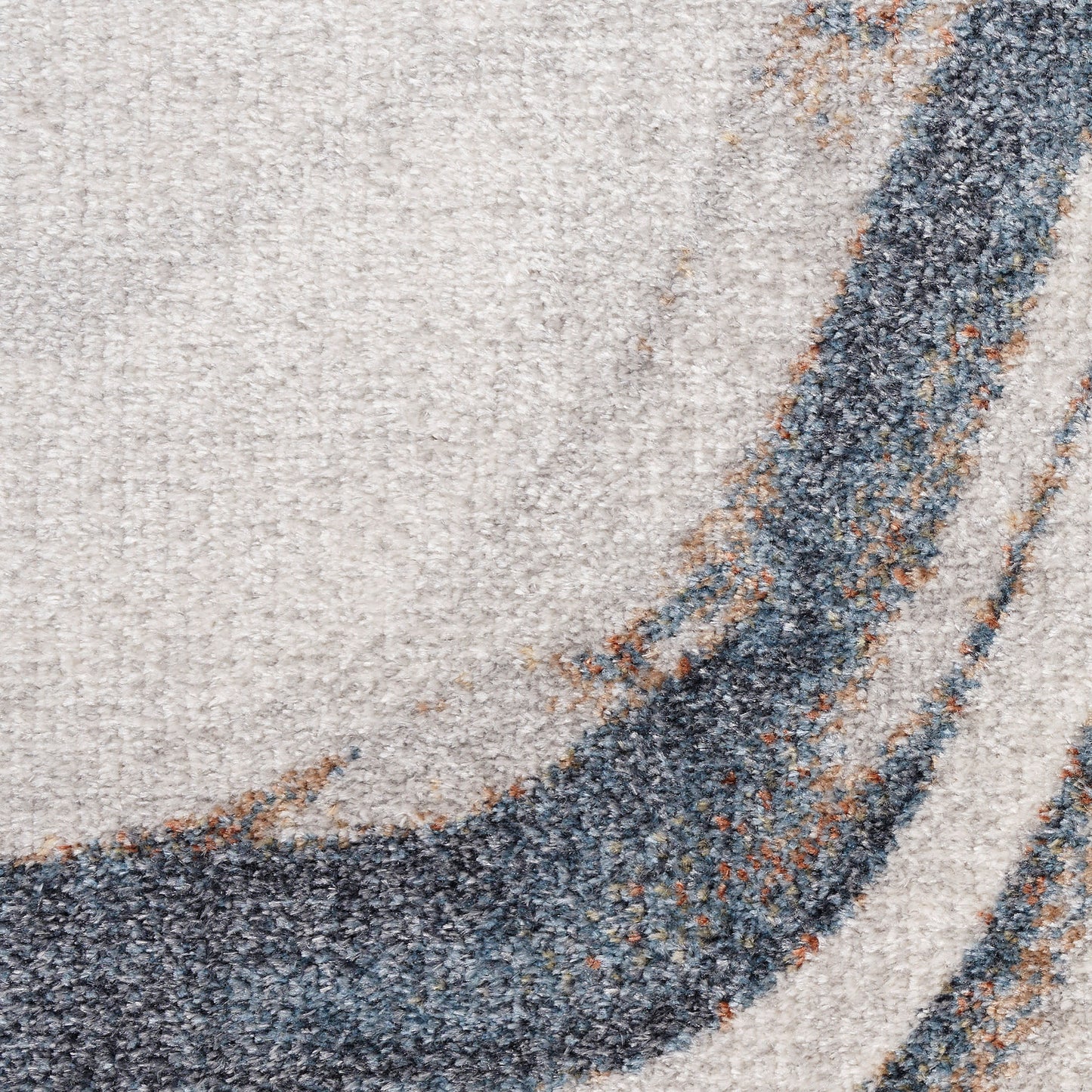 Beige plush rug close-up with a dark gray curved stripe and brown accents; abstract modern floor decor.