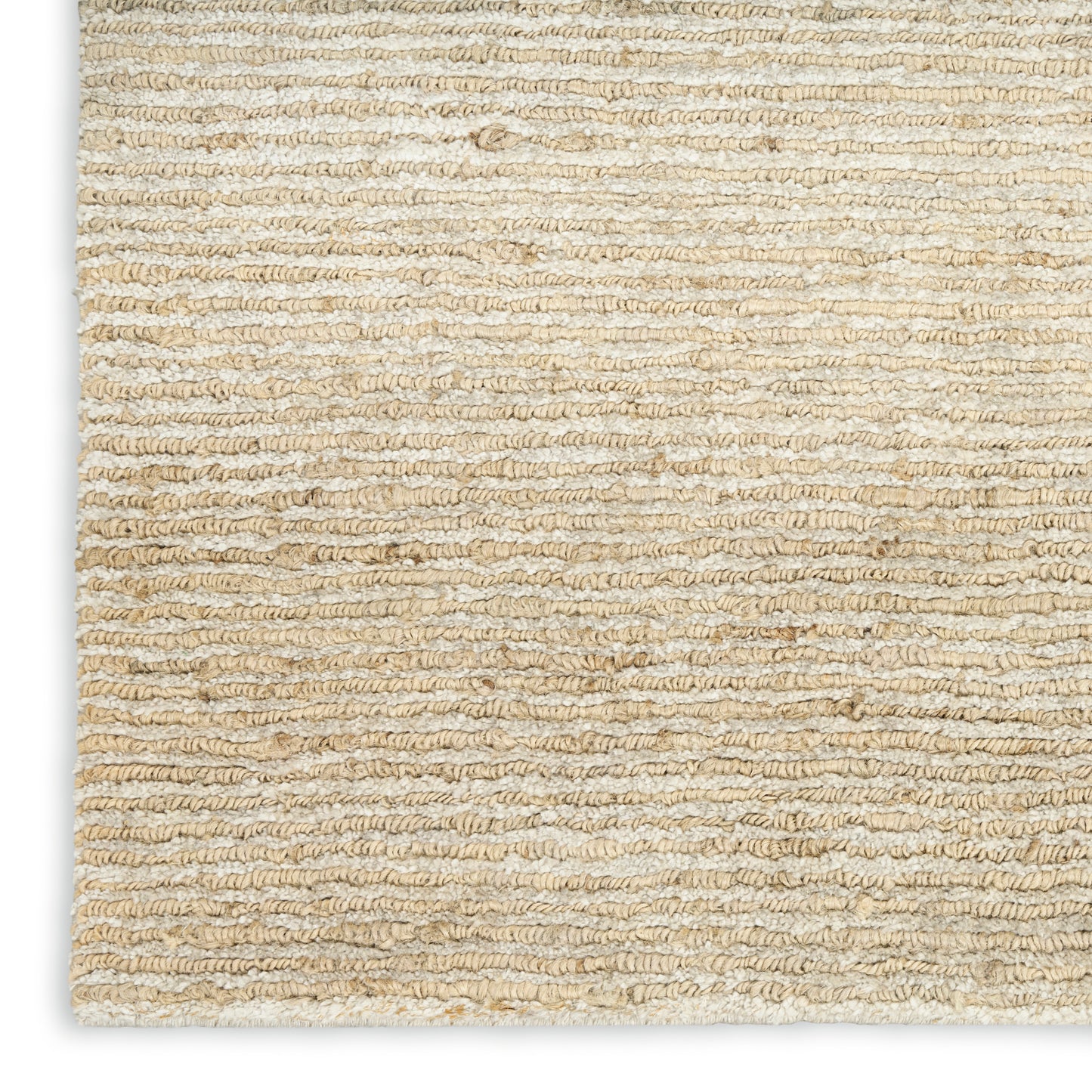 Beige textured loop-pile rug close-up; natural fibers with horizontal ridges.