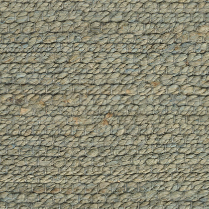 Close-up of natural jute rope-weave rug in beige-gray; rustic rug texture.
