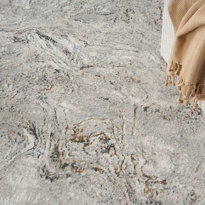Marbled gray, ivory, and brown area rug with plush texture.