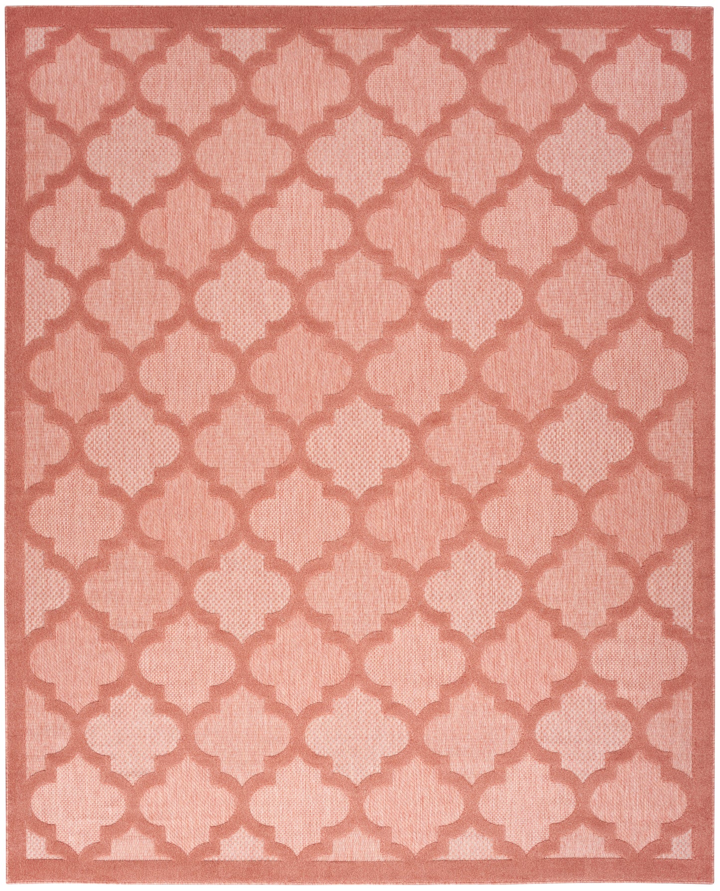 Pink area rug with coral quatrefoil trellis pattern and matching border; soft woven texture.