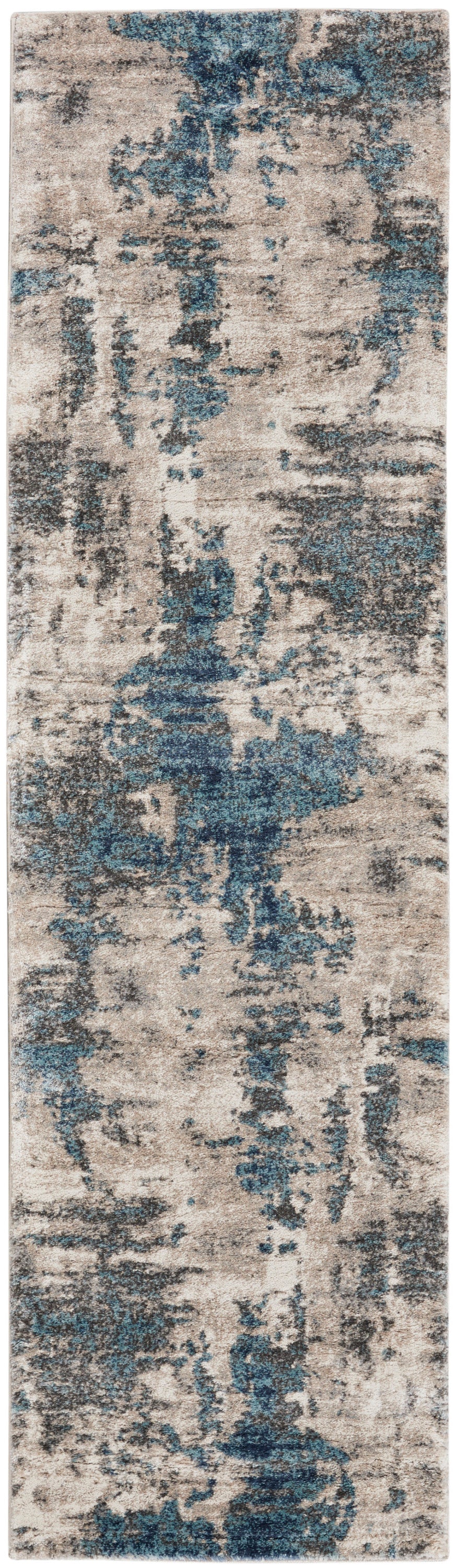 Narrow rectangular runner rug in beige, gray and blue with a modern, painterly distressed pattern.