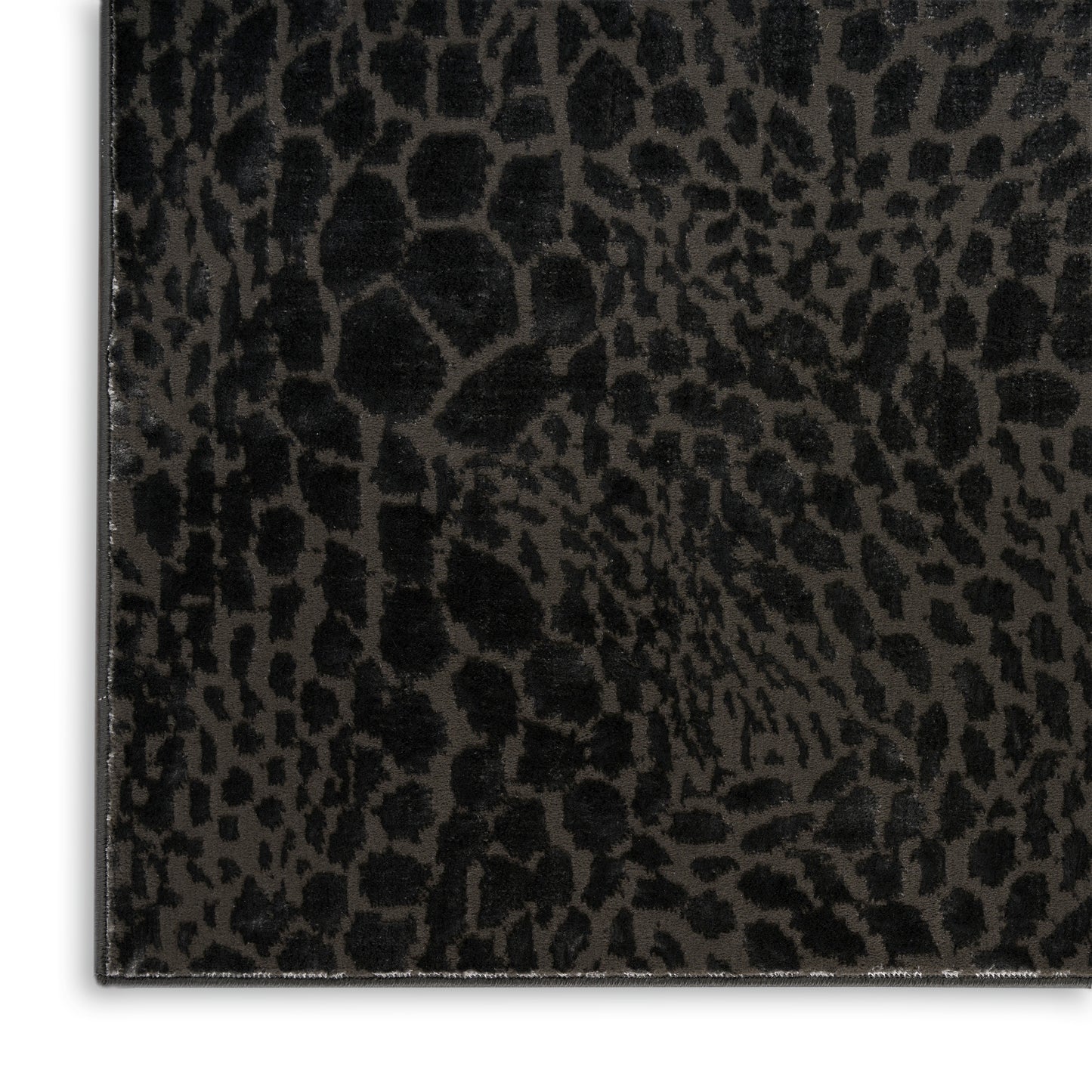 Rectangular rug, 4' x 6', with a black leopard-print pattern and a stitched edge.