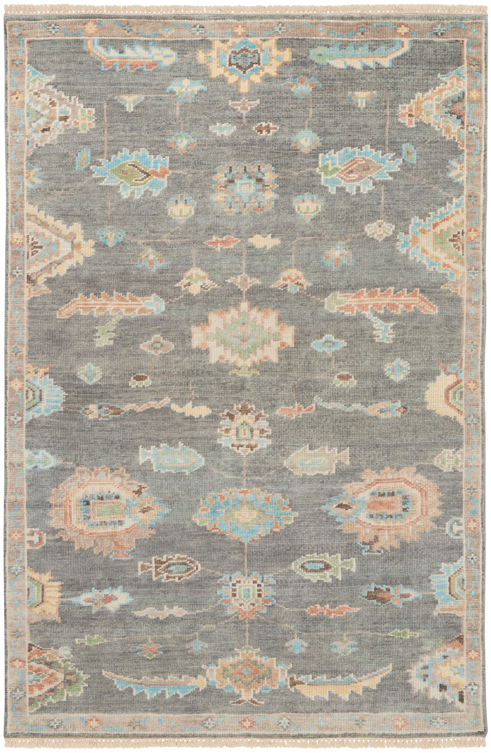 Gray-blue oriental area rug with pastel floral/arabesque motifs, cream fringe at ends, and a Persian-inspired border.