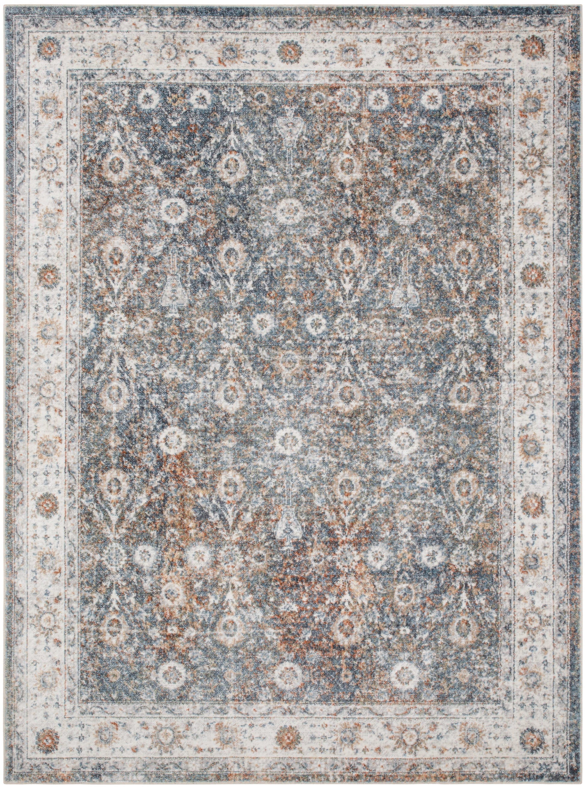 Distressed blue Persian-style area rug with ivory border and intricate floral medallion motifs.