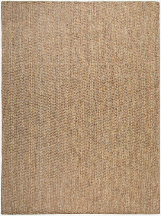 Natural tan woven rug with subtle chevron pattern, flat-weave style in warm beige.