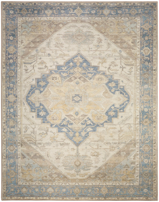 Rectangular distressed oriental rug with cream beige field, blue central medallion, soft gold accents, blue & ornate border.