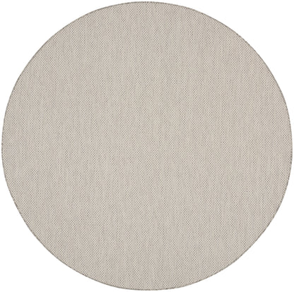 Beige round fabric disc with dotted mesh texture; minimalist round décor accessory.