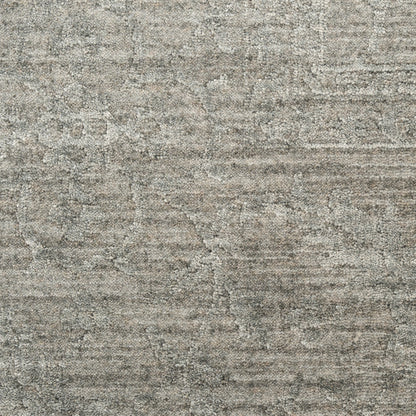 Gray textured rug with muted distressed pattern and soft, dense loop pile for a neutral living space.