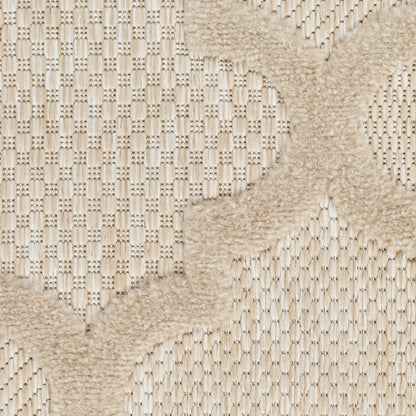 Cream knitted textile rug with plush beige X-shaped motif on a woven background.