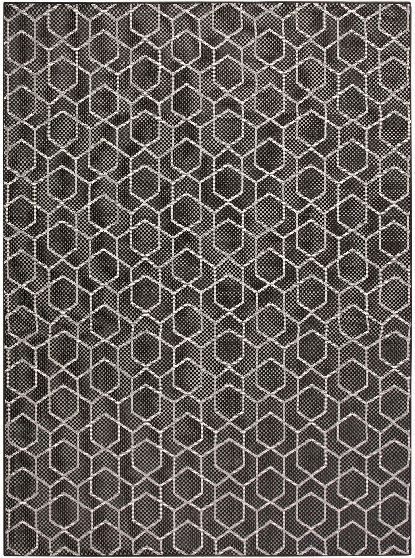 Dark gray rug with a white hexagon honeycomb pattern and woven texture; modern geometric floor decor.
