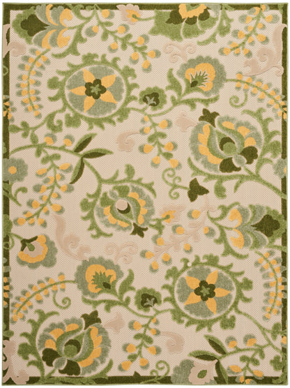 Rectangular outdoor area rug with beige base and green-yellow scrolling floral damask pattern; textured woven surface.
