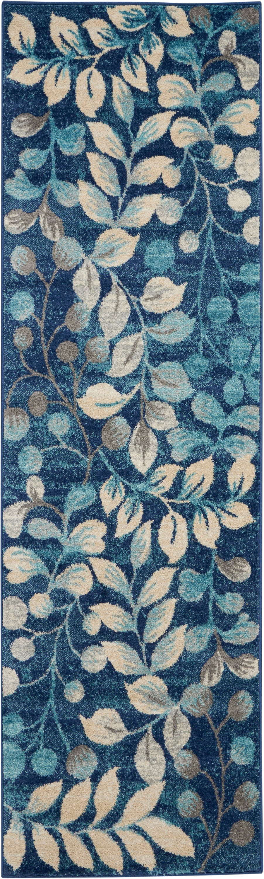 Rectangular navy rug with teal, cream and beige leafy vine pattern; blue border, plush indoor decor.