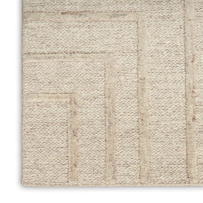 Beige woven rug with geometric rectangular block pattern, textured loop pile, ideal for living room decor.