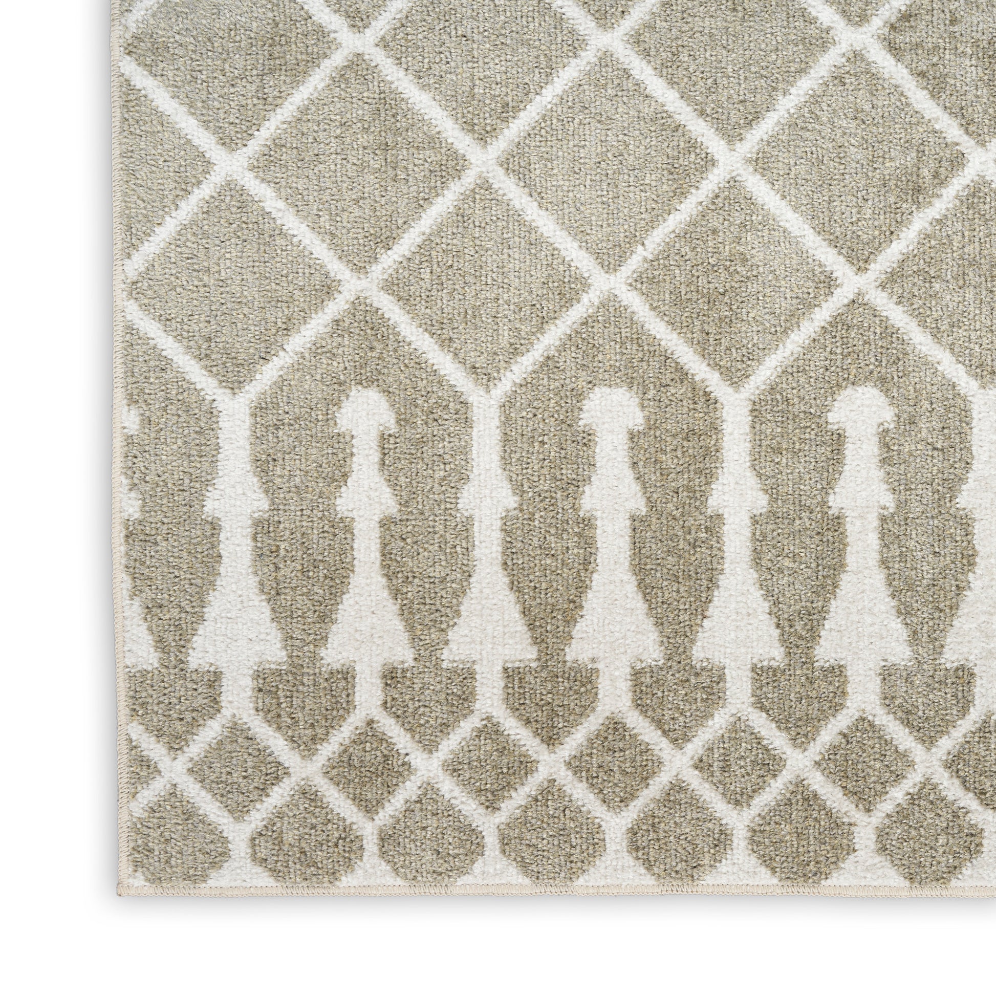 Beige area rug with white lattice pattern and row of abstract human silhouettes; woven texture, geometric decor.