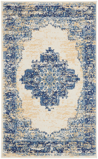Distressed blue and ivory oriental rug with central medallion and ornate border; vintage look, plush pile.