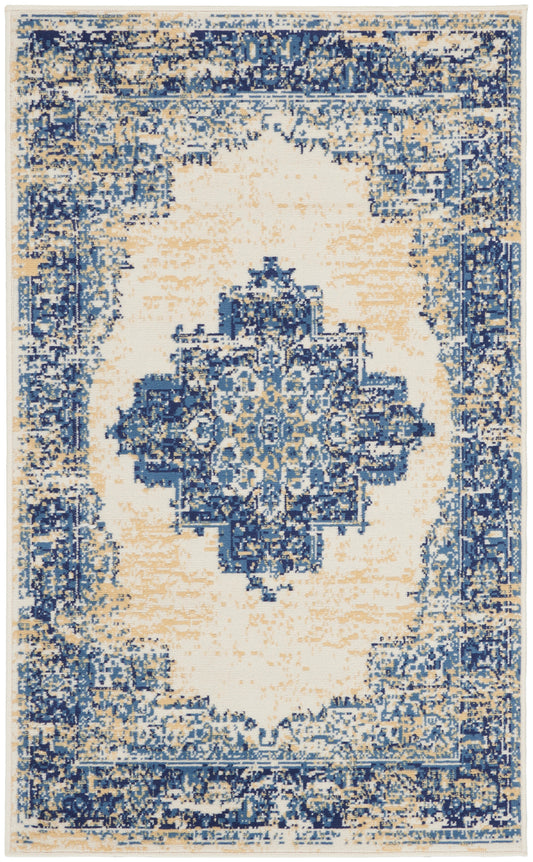 Distressed blue and ivory oriental rug with central medallion and ornate border; vintage look, plush pile.