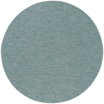 Round teal-blue rug with a subtle quilted diamond grid pattern and soft textured surface.