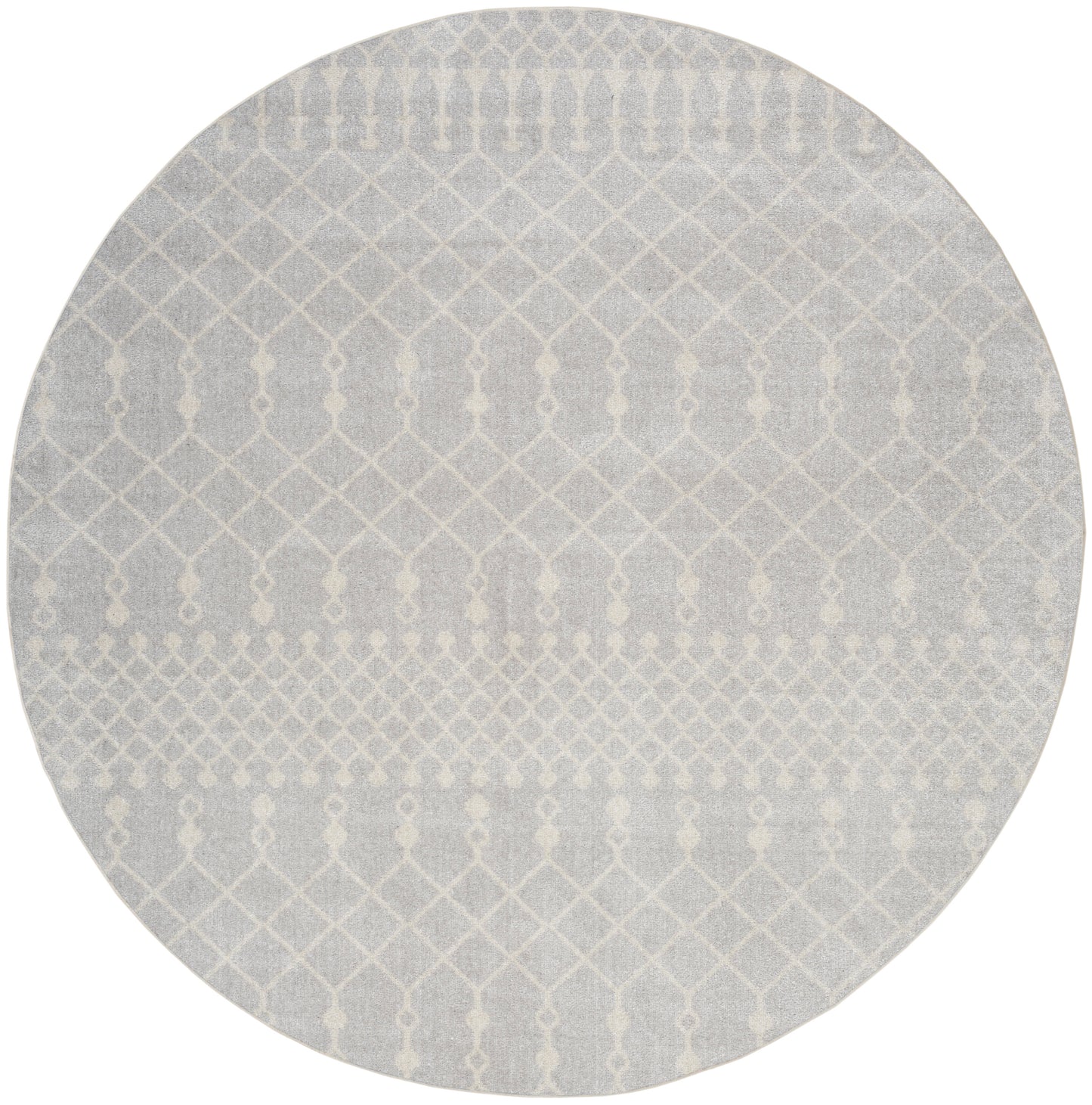 Round gray rug with white geometric lattice pattern; modern, textured, low-pile style.
