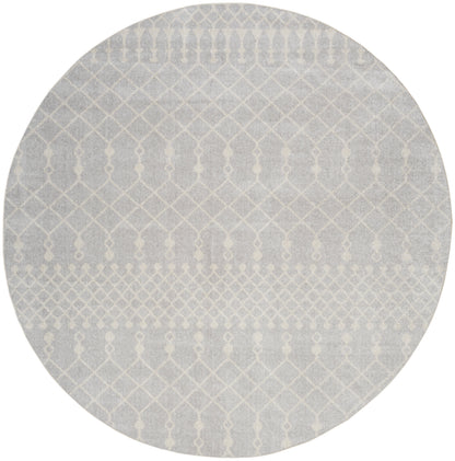 Round gray rug with white geometric lattice pattern; modern, textured, low-pile style.