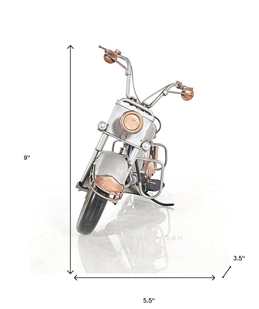 Copper & chrome miniature motorcycle sculpture with brown leather seat, vintage desk decor.