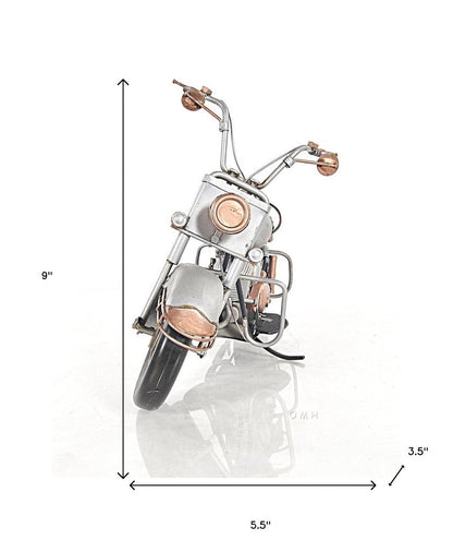 Copper & chrome miniature motorcycle sculpture with brown leather seat, vintage desk decor.