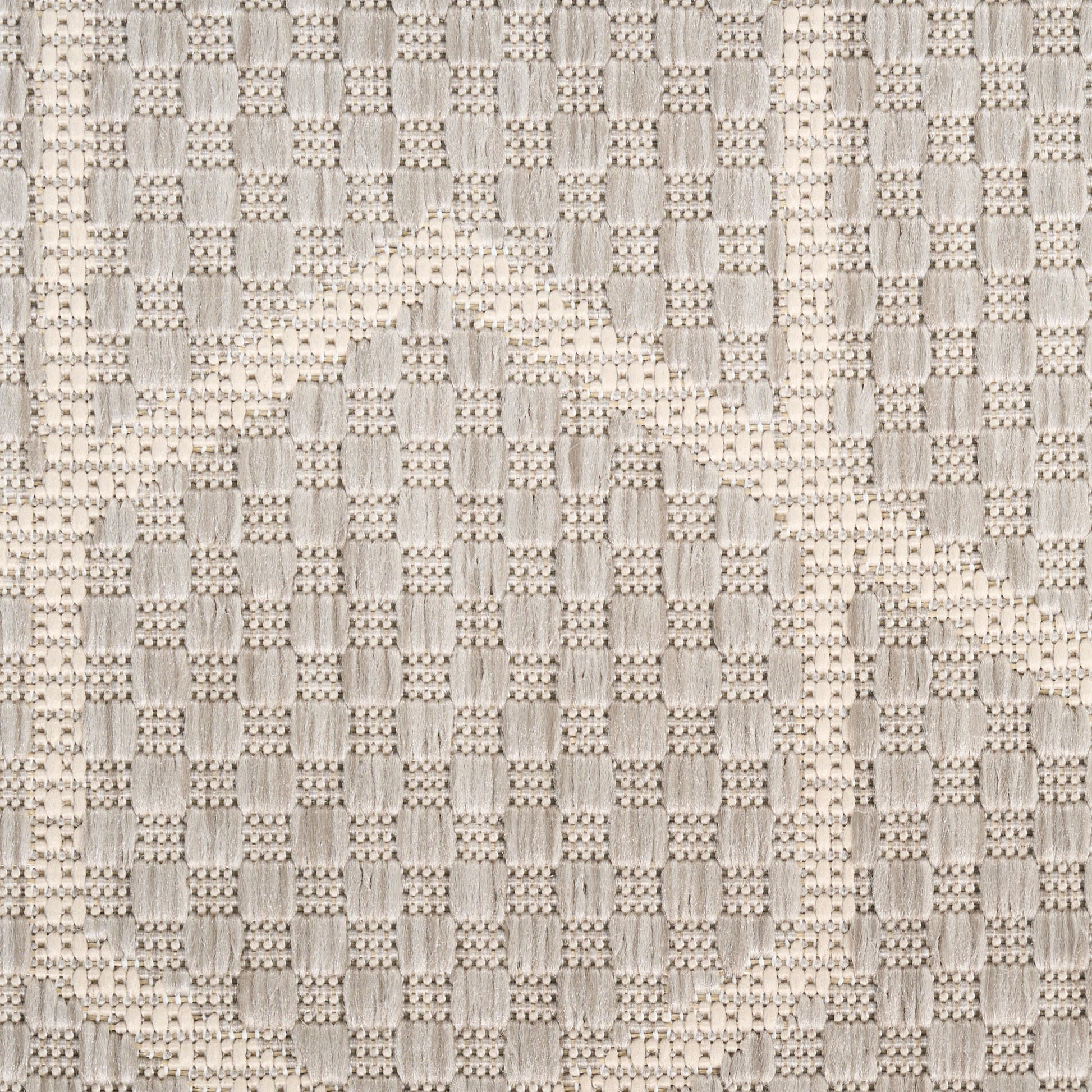 Beige textured basketweave rug with a circular motif in neutral tones, 5' x 7'.