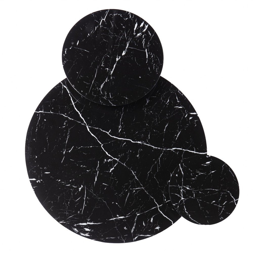 Three circular black marble coasters with white veining, arranged in small, medium, and large sizes.