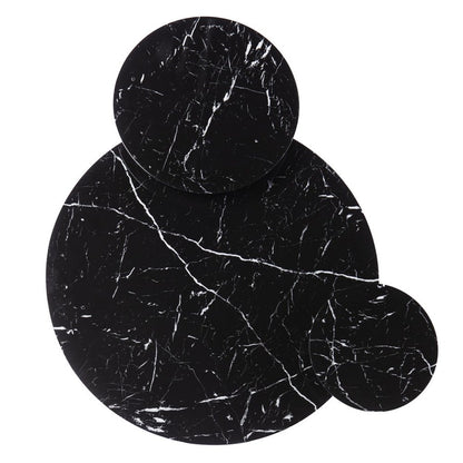 Three circular black marble coasters with white veining, arranged in small, medium, and large sizes.