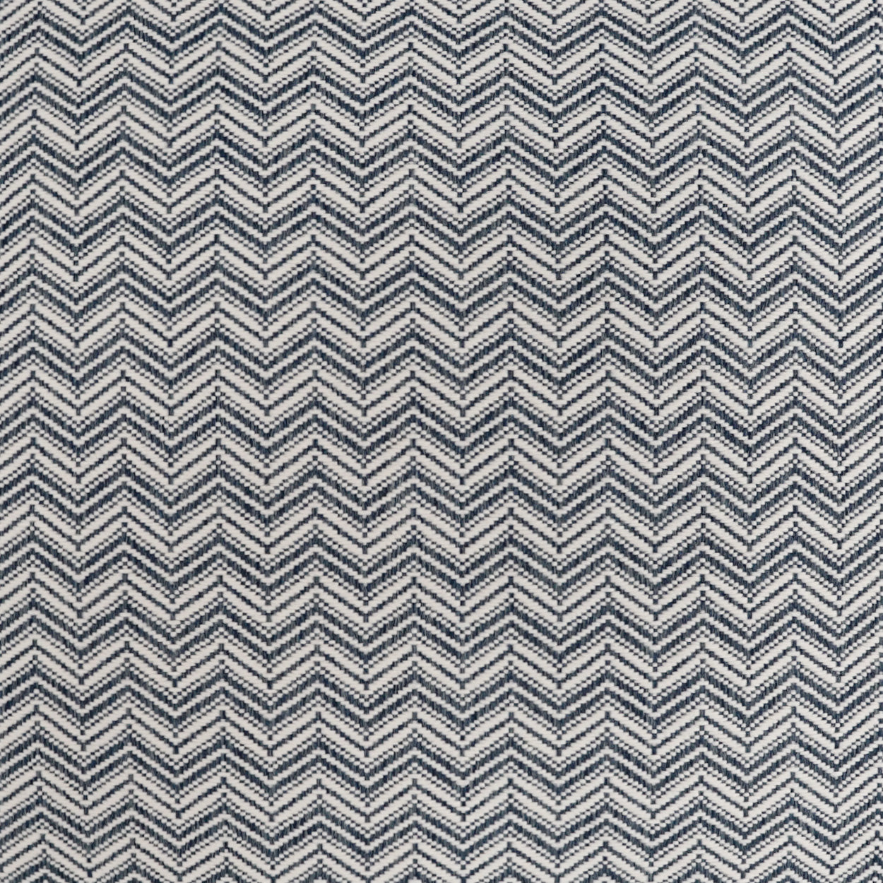 Navy and cream chevron herringbone fabric texture.