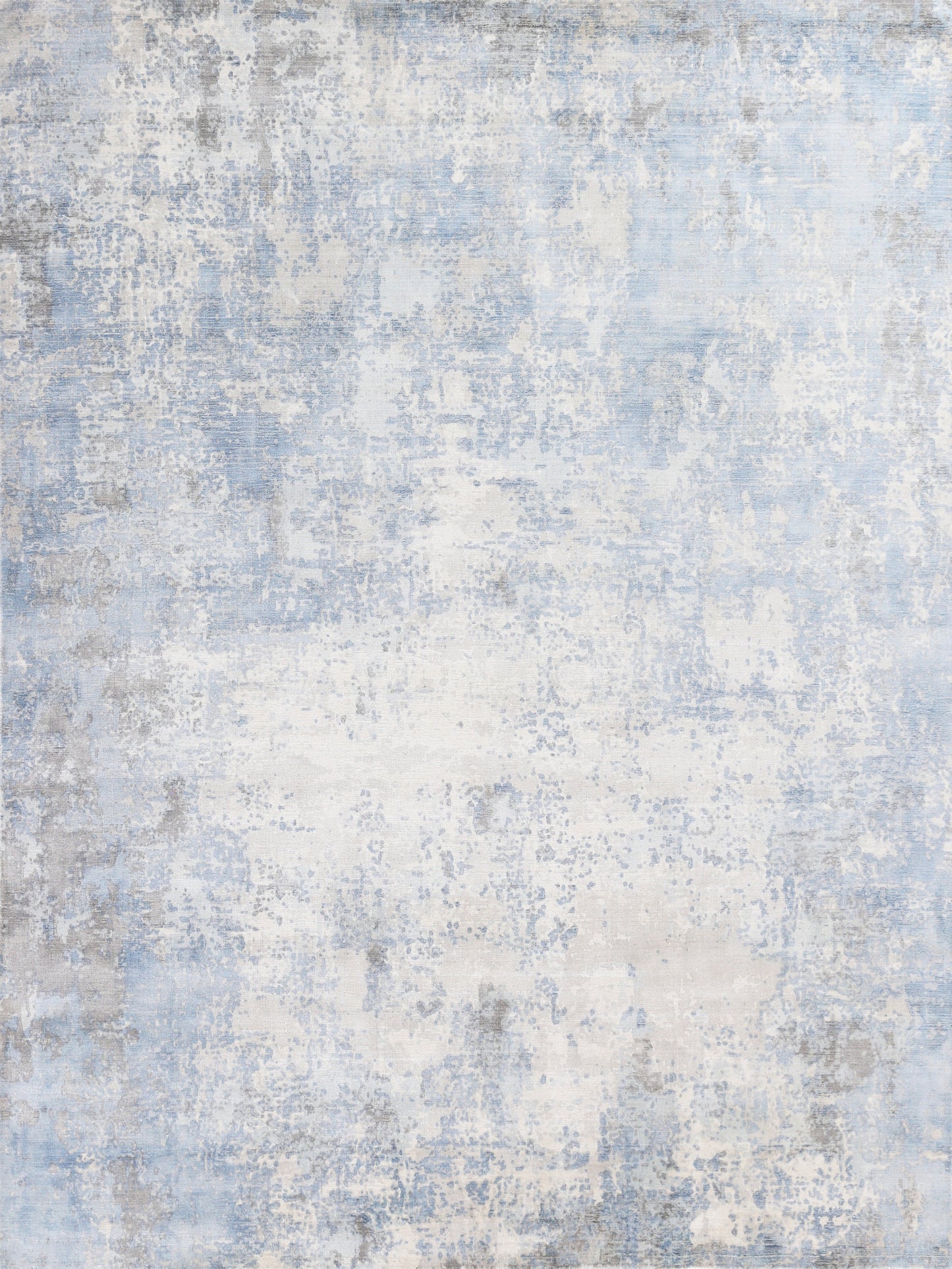 Blue and white distressed abstract rug with gray accents and soft textured pile.