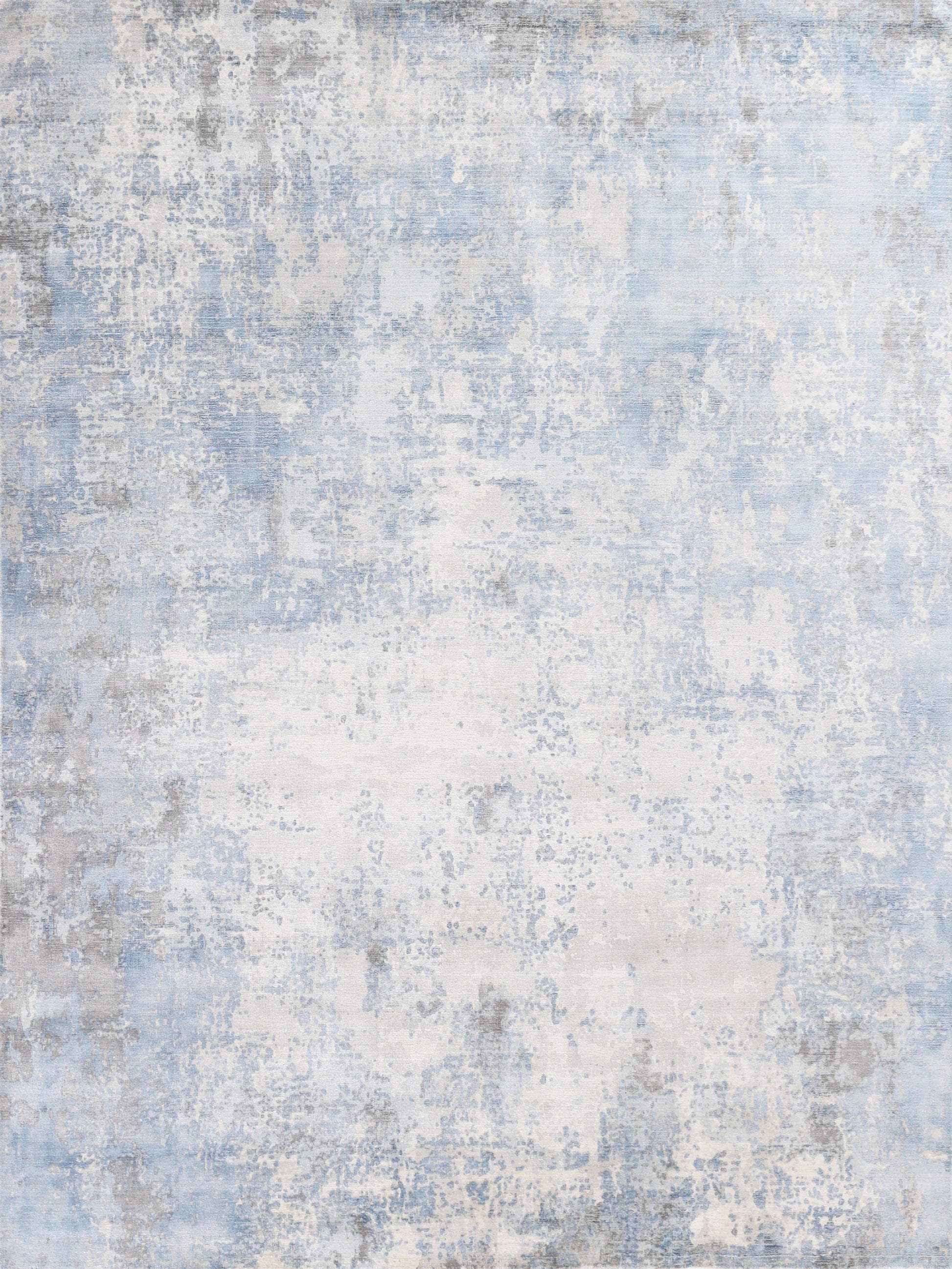 Blue and white distressed abstract rug with gray accents and soft textured pile.