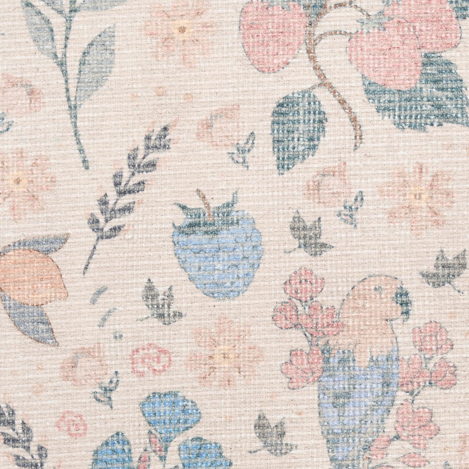 Pastel floral woven fabric with blue, peach and pink blossoms on beige background; vintage garden-inspired textile.
