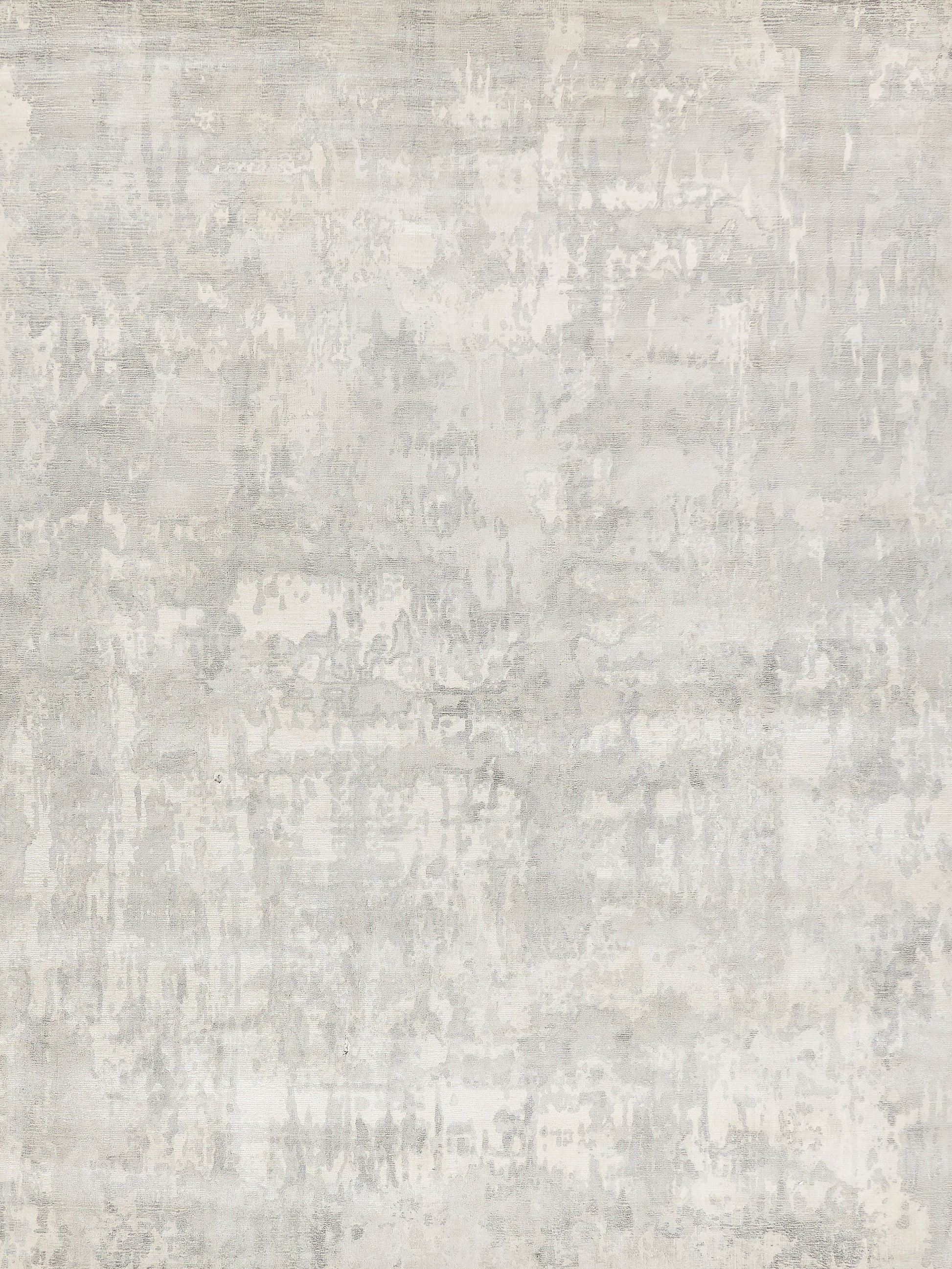 Light gray rug with a concrete-texture pattern and cream mottling; neutral industrial style, hand-loomed, 4' x 6'.